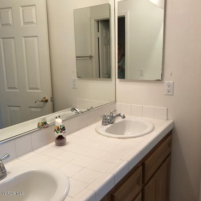 1511 Hidden Ranch Drive Simi Valley, CA 93063 - Photo 15 of 27 a bathroom with a sink and a mirror