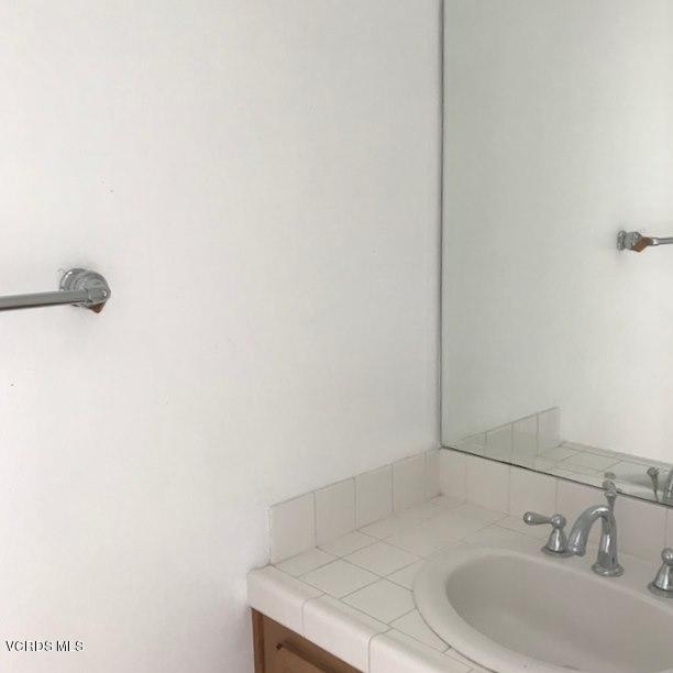1511 Hidden Ranch Drive Simi Valley, CA 93063 - Photo 7 of 27 a bathroom with a sink and a mirror