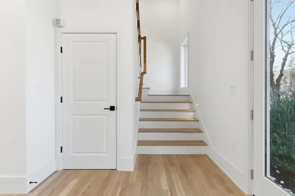 a view of entryway with wooden floor