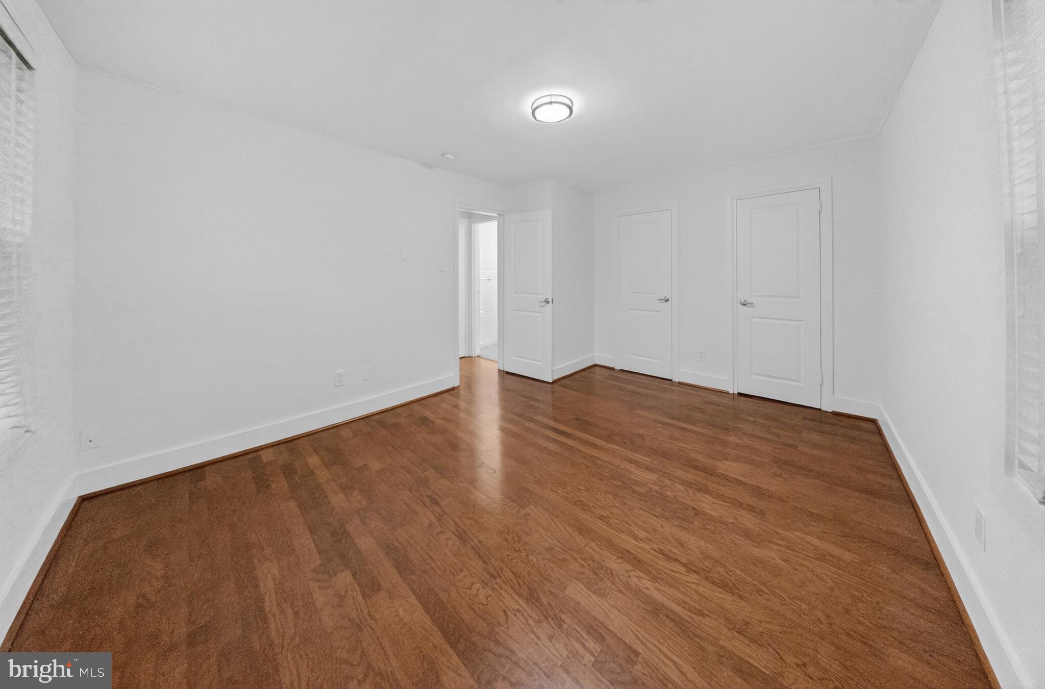 4840 MacArthur Boulevard Northwest, Unit 401 Washington, DC 20007 - Photo 15 of 18 a view of empty room with wooden floor
