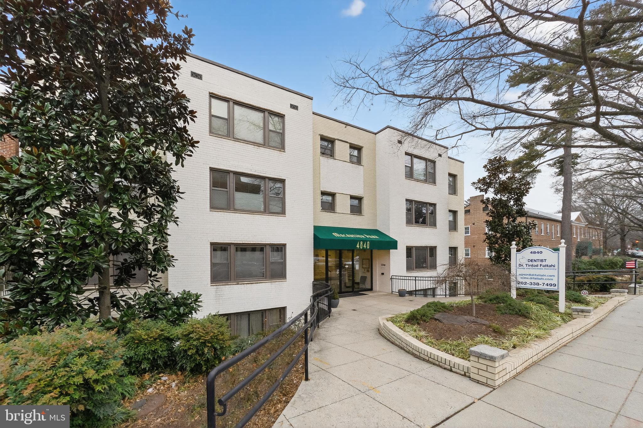 4840 MacArthur Boulevard Northwest, Unit 401 Washington, DC 20007 - Photo 2 of 18 a front view of a residential houses with yard