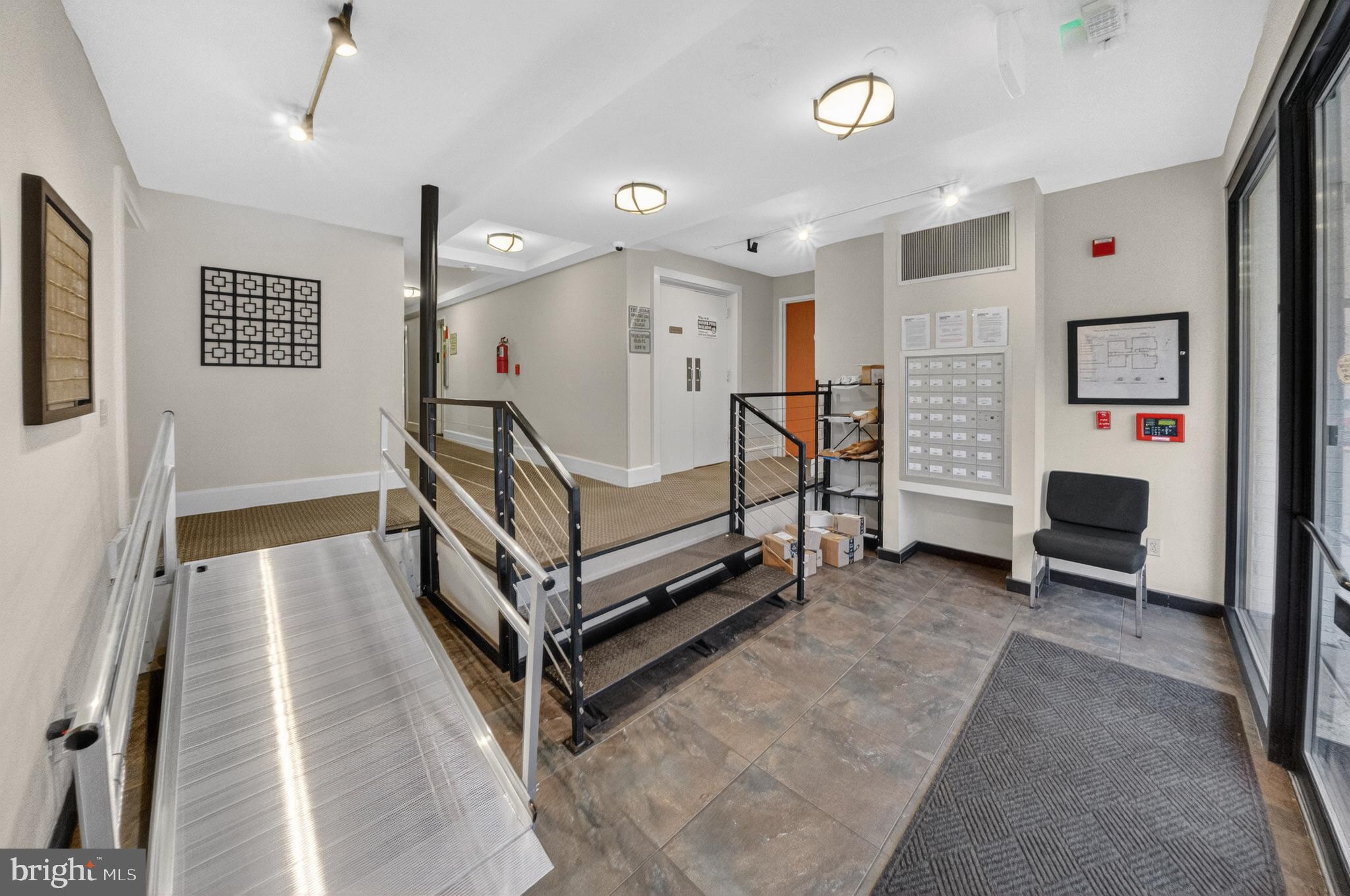 4840 MacArthur Boulevard Northwest, Unit 401 Washington, DC 20007 - Photo 4 of 18 a bedroom with furniture and a window