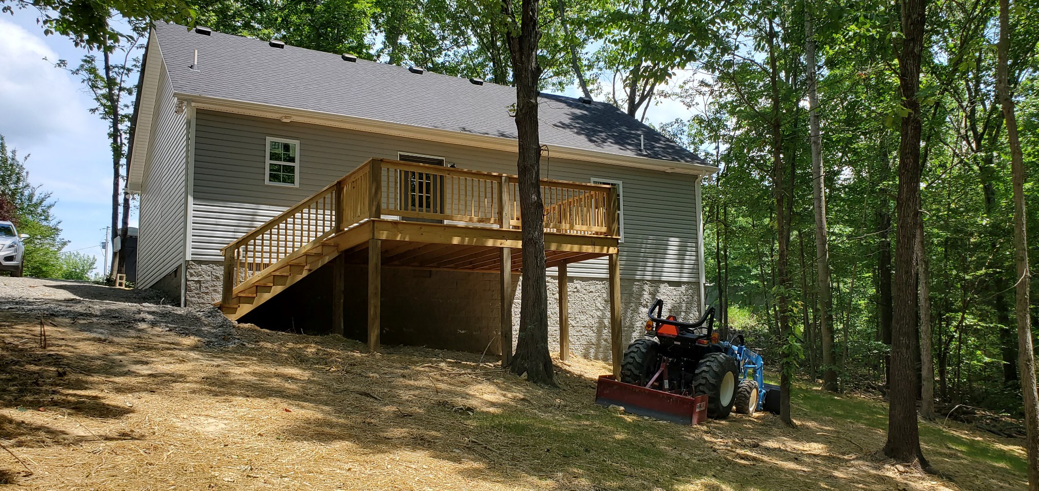 678 Hog Back Ridge Road Bethpage, TN 37022 - Photo 4 of 9 a view of a house with backyard and trees