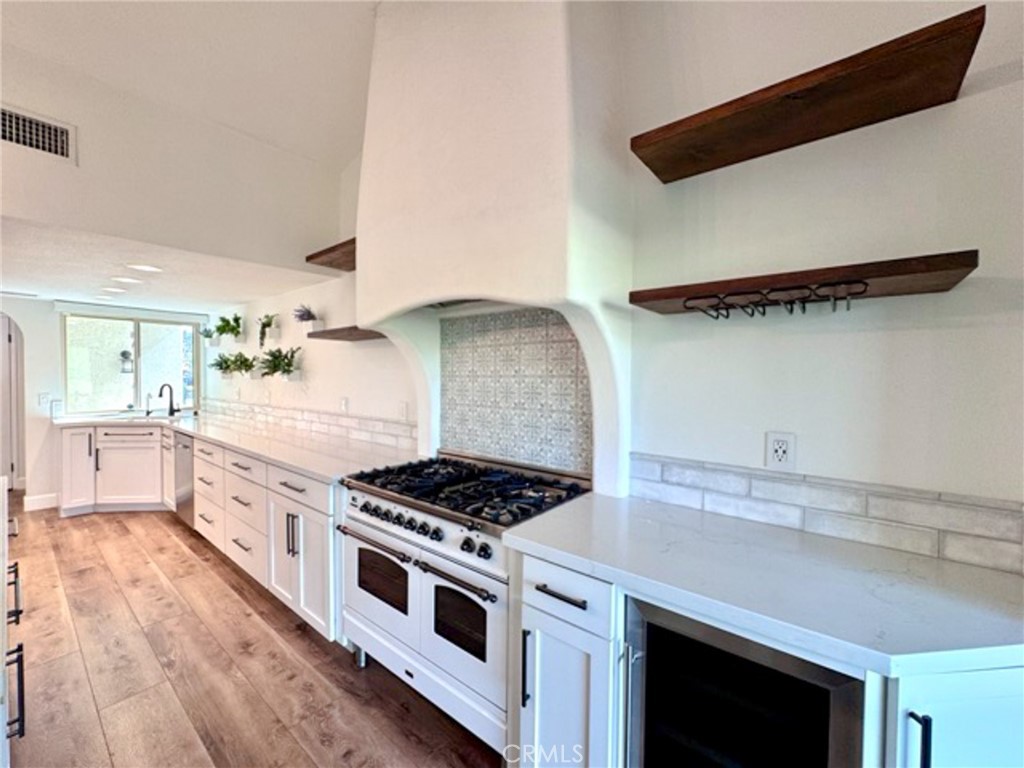38901 Pso Corta Murrieta, CA 92563 - Photo 14 of 51 a kitchen with granite countertop a stove and a sink