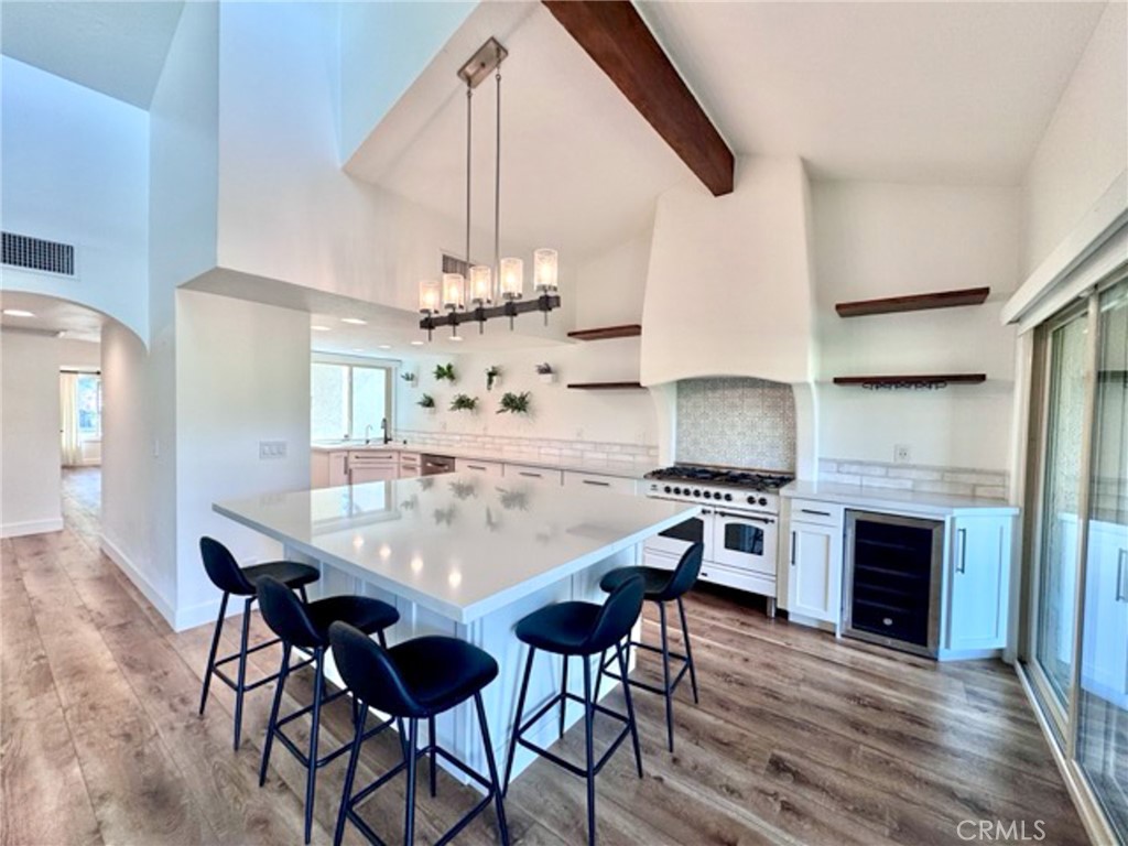 38901 Pso Corta Murrieta, CA 92563 - Photo 17 of 51 a view of a dining room with furniture and wooden floor