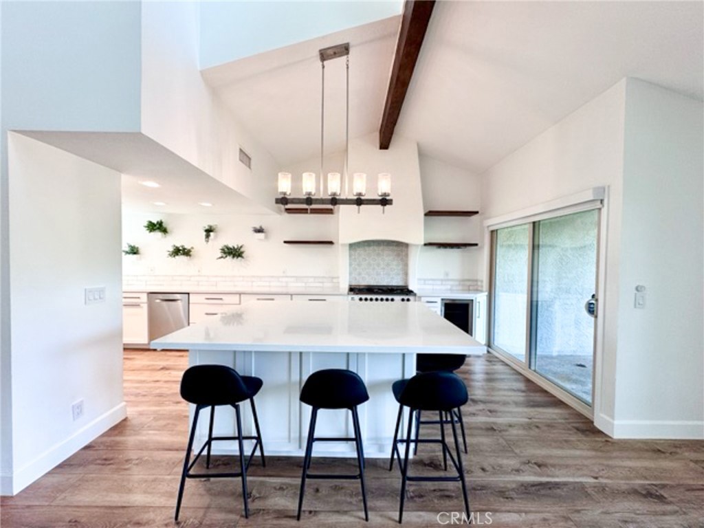38901 Pso Corta Murrieta, CA 92563 - Photo 18 of 51 a kitchen with cabinets and chairs