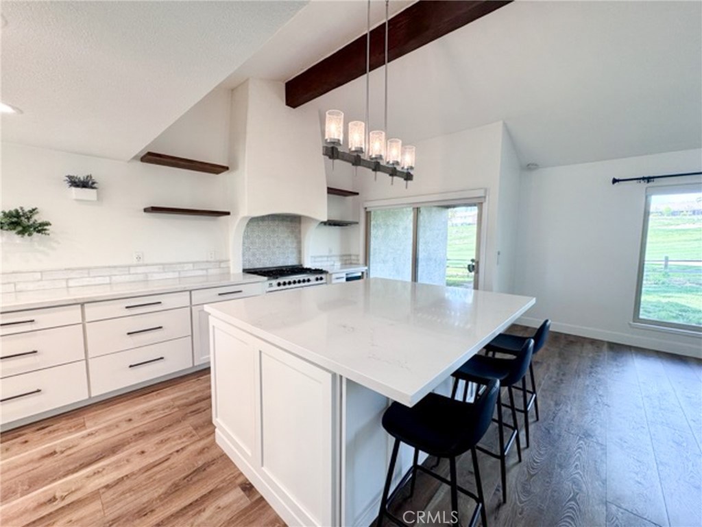 38901 Pso Corta Murrieta, CA 92563 - Photo 19 of 51 a kitchen with a table and chairs