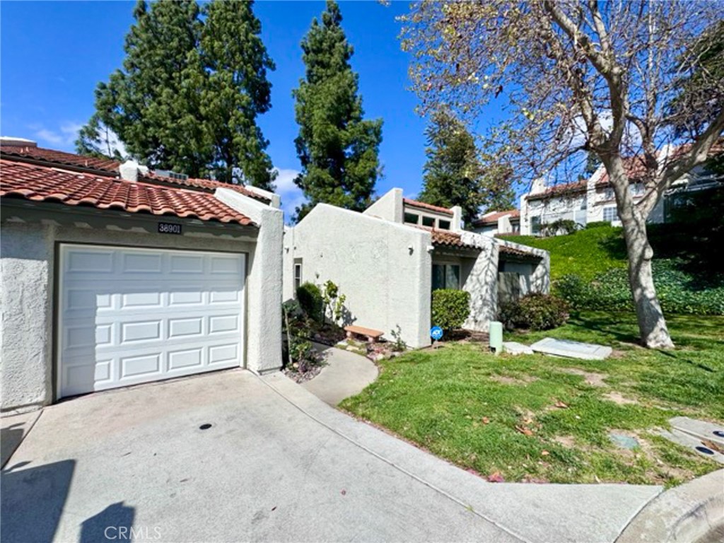 38901 Pso Corta Murrieta, CA 92563 - Photo 2 of 51 front view of a house with a yard