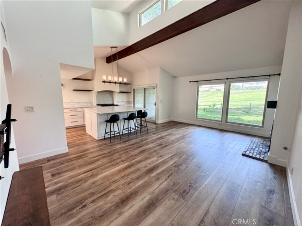 38901 Pso Corta Murrieta, CA 92563 - Photo 23 of 51 a view of a livingroom with furniture wooden floor and window