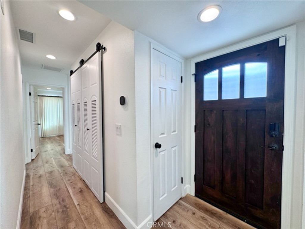 38901 Pso Corta Murrieta, CA 92563 - Photo 27 of 51 a view of a hallway with wooden floor and closet area