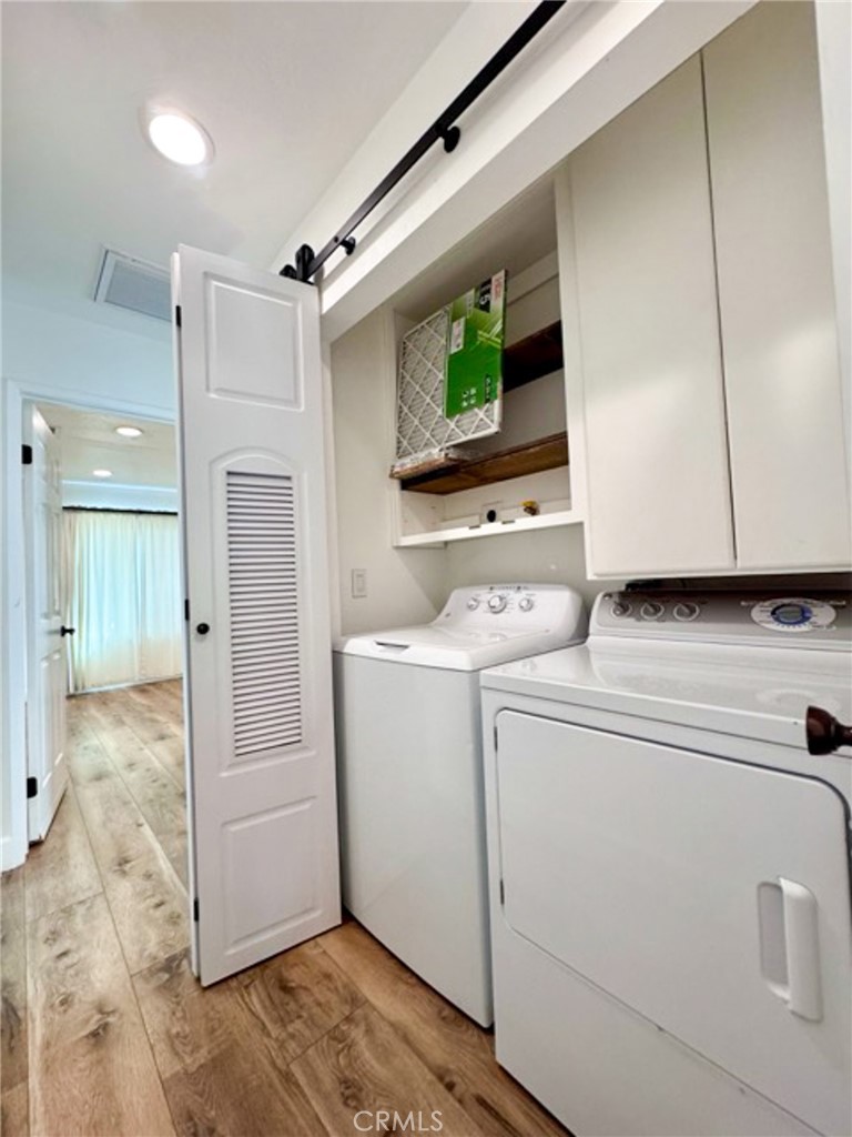 38901 Pso Corta Murrieta, CA 92563 - Photo 28 of 51 a view of storage and utility room with washer and dryer