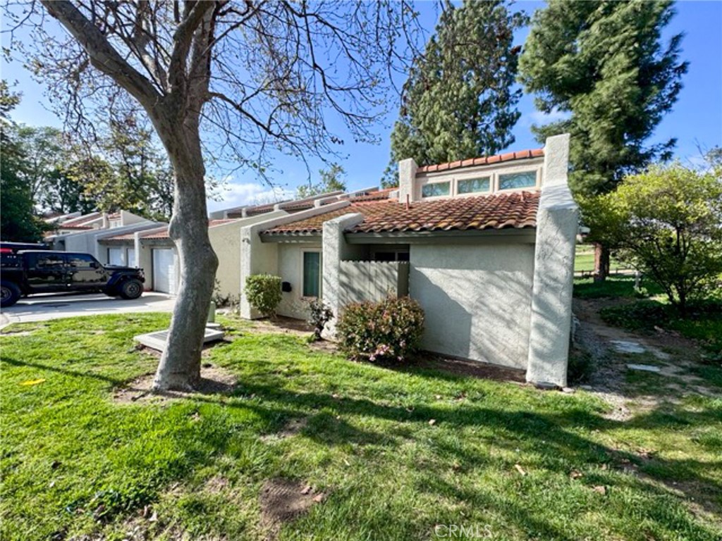 38901 Pso Corta Murrieta, CA 92563 - Photo 3 of 51 a view of a house with a yard and tree