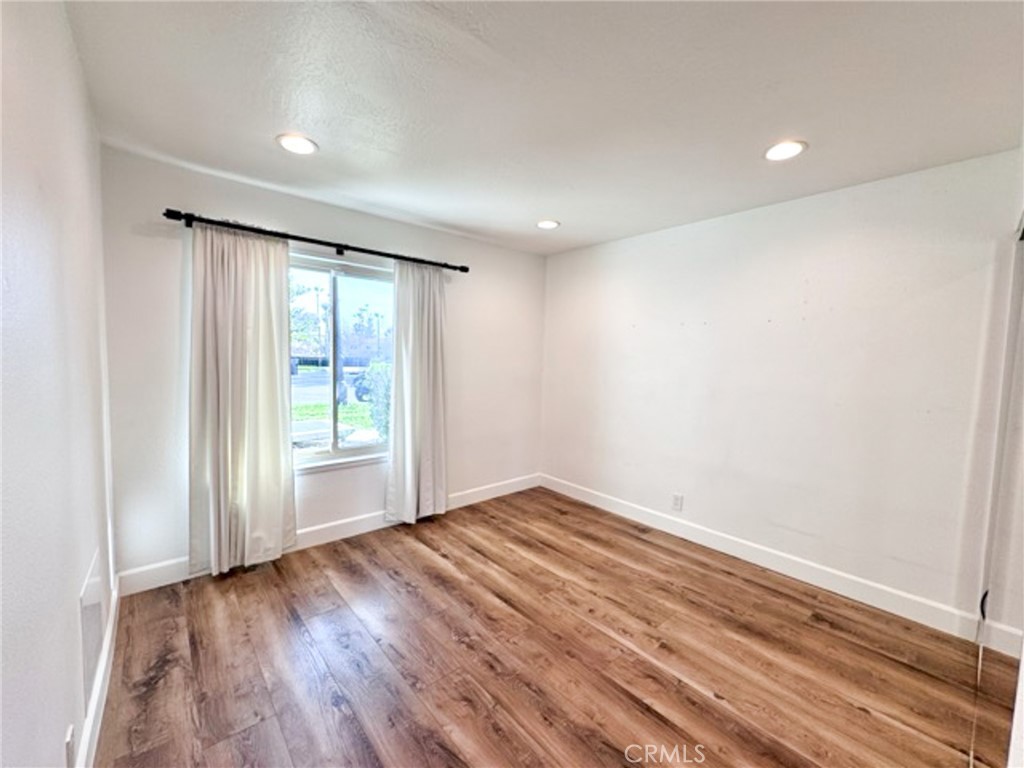 38901 Pso Corta Murrieta, CA 92563 - Photo 31 of 51 an empty room with wooden floor and windows