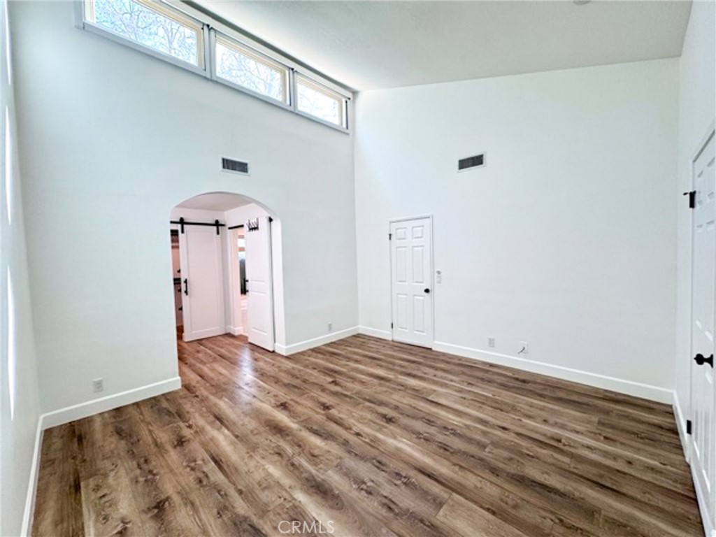 38901 Pso Corta Murrieta, CA 92563 - Photo 34 of 51 a view of empty room with wooden floor