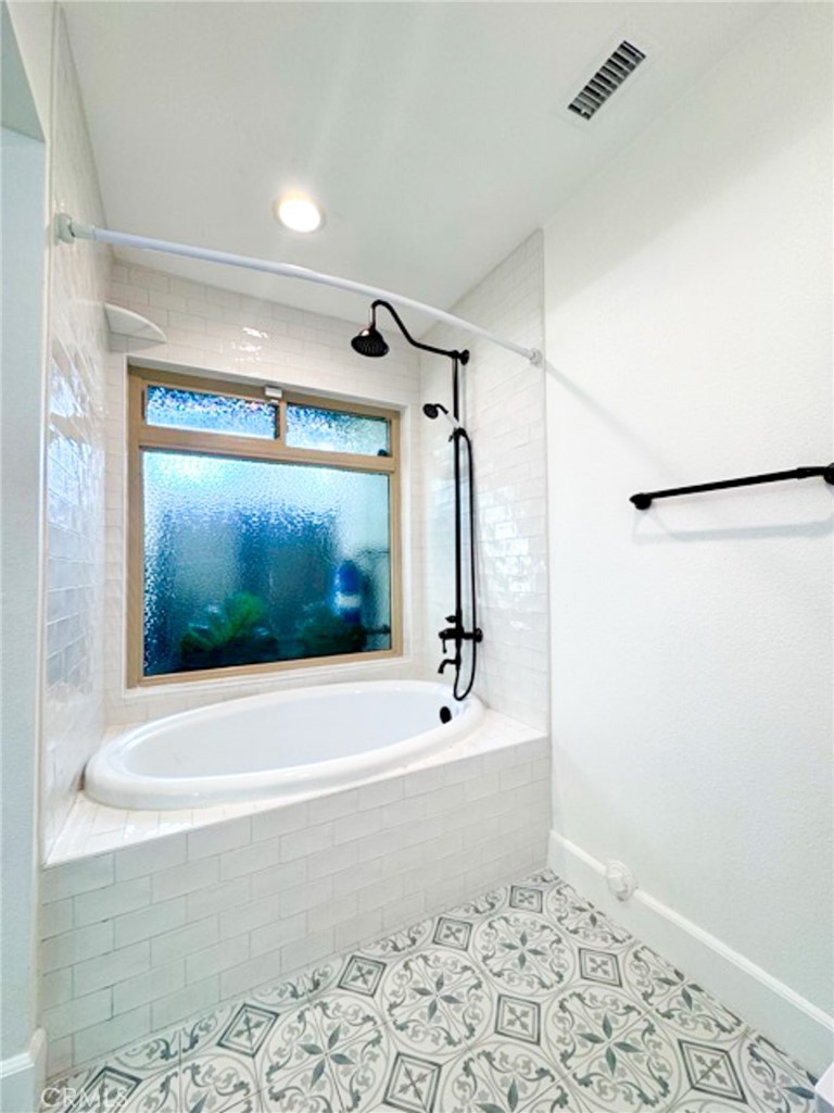 38901 Pso Corta Murrieta, CA 92563 - Photo 37 of 51 a bathroom with a shower and a bathtub