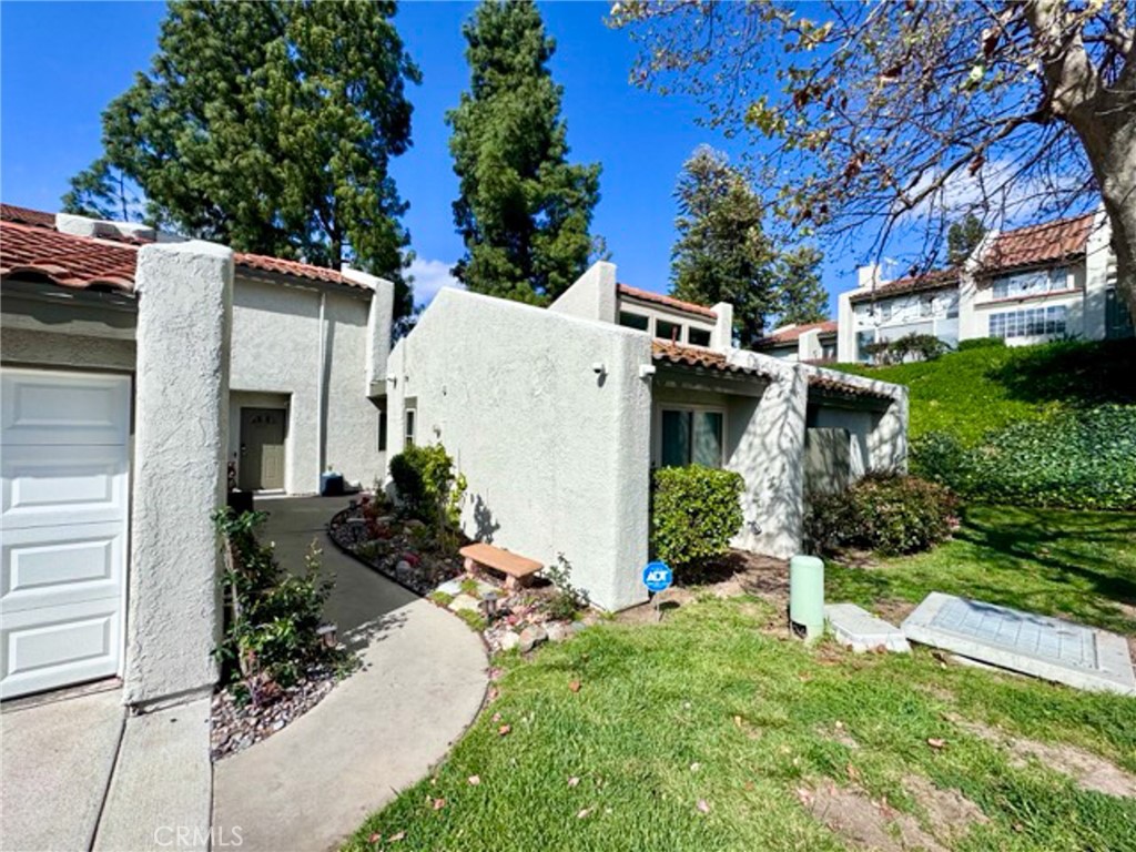 38901 Pso Corta Murrieta, CA 92563 - Photo 5 of 51 a front view of a house with a yard