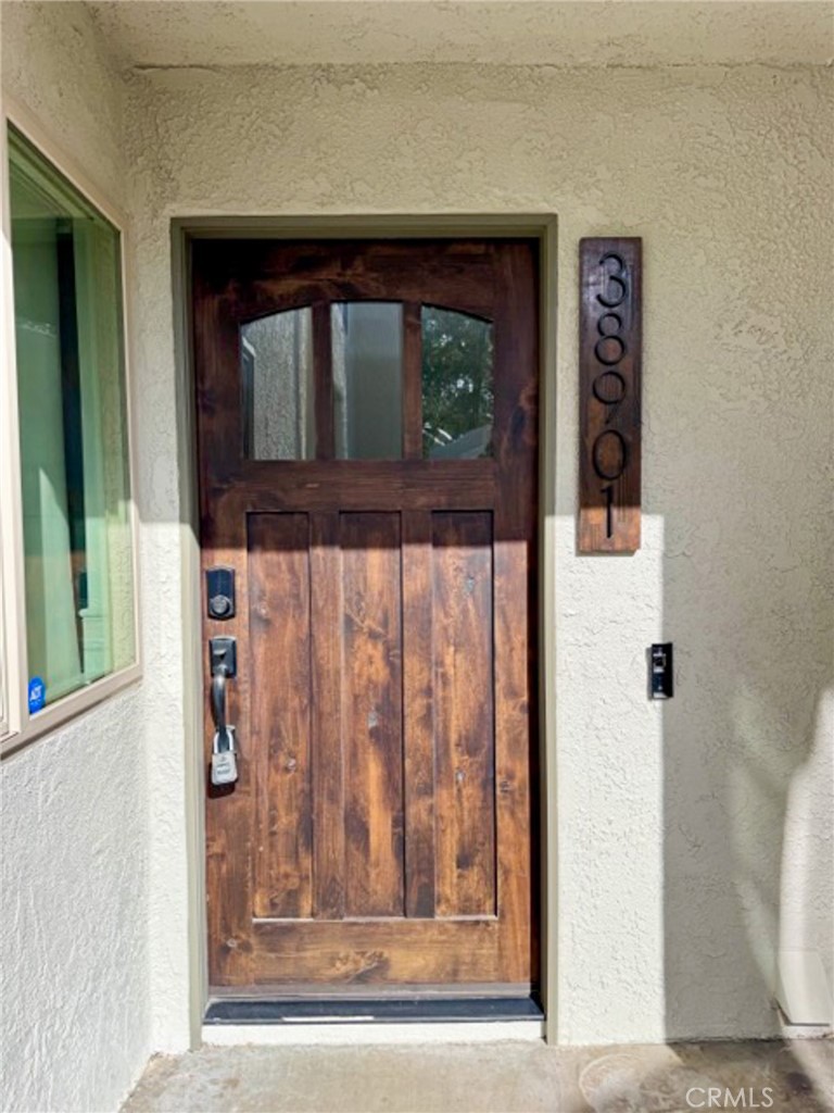 38901 Pso Corta Murrieta, CA 92563 - Photo 8 of 51 a view of front door of house