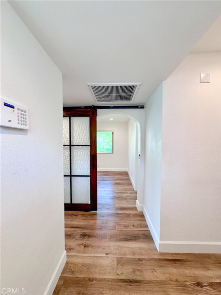 38901 Pso Corta Murrieta, CA 92563 - Photo 9 of 51 a view of a hallway with wooden floor and entryway