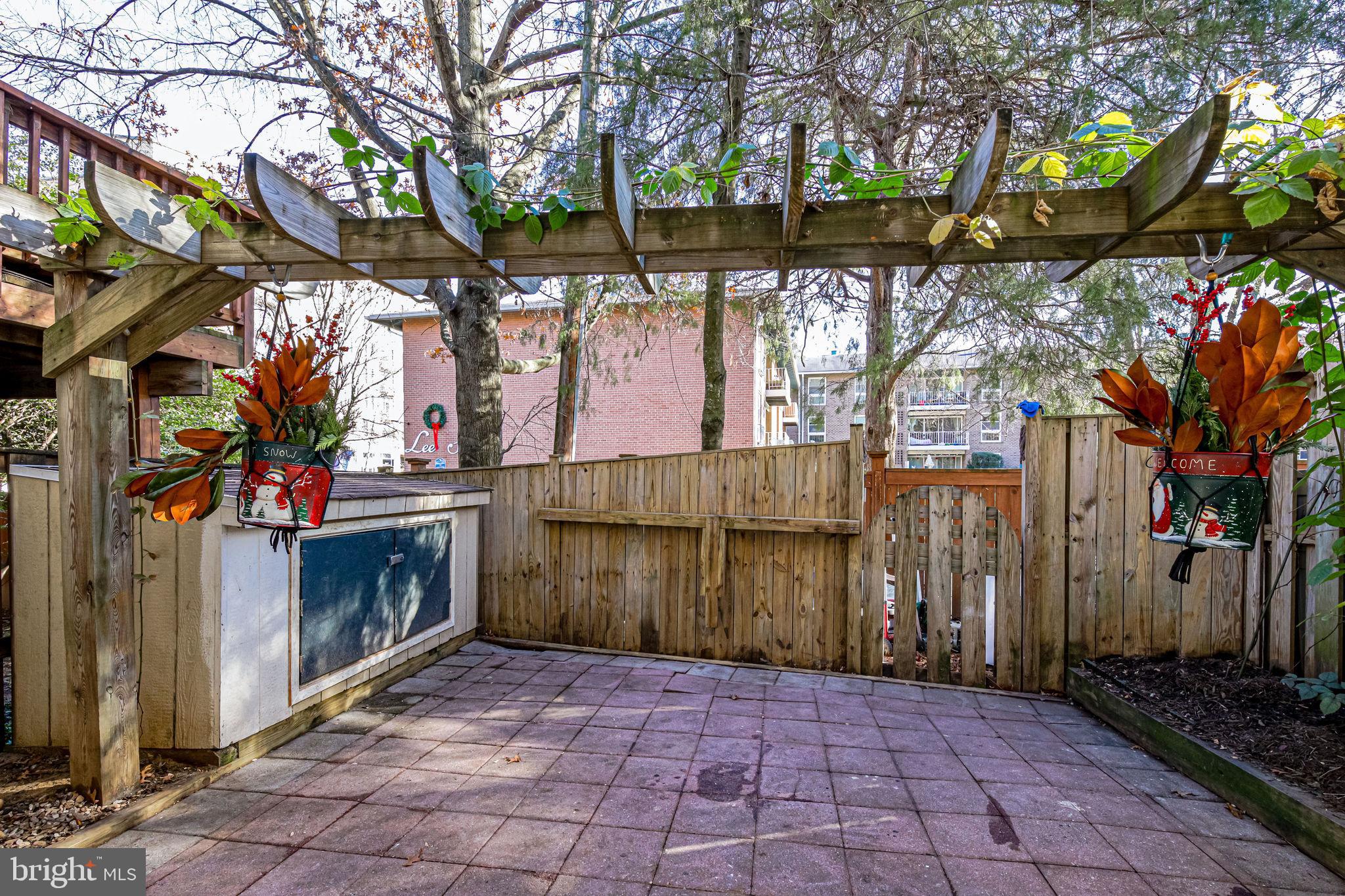 105 Rees Place Falls Church, VA 22046 - Photo 54 of 60 Fully Fence Patio with Stone Flooring and Shed