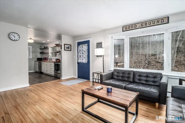 a living room with furniture and a window