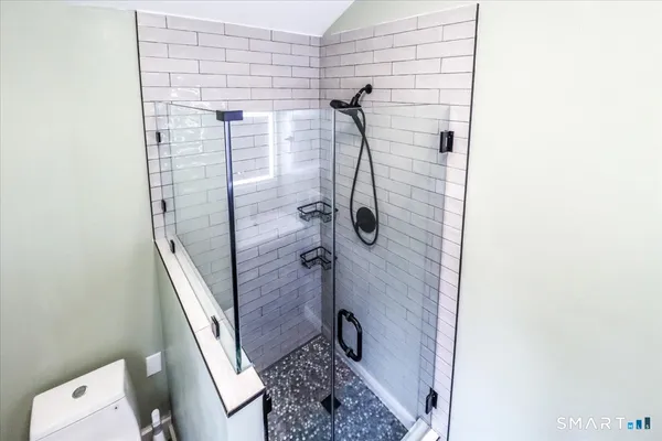 a view of an entryway with wooden floor