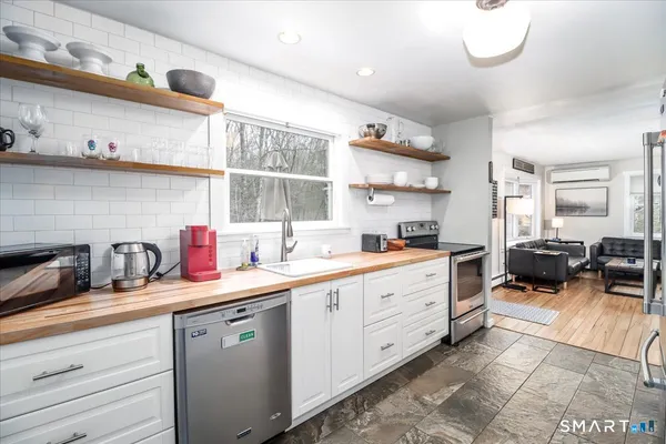 a kitchen with cabinets and window