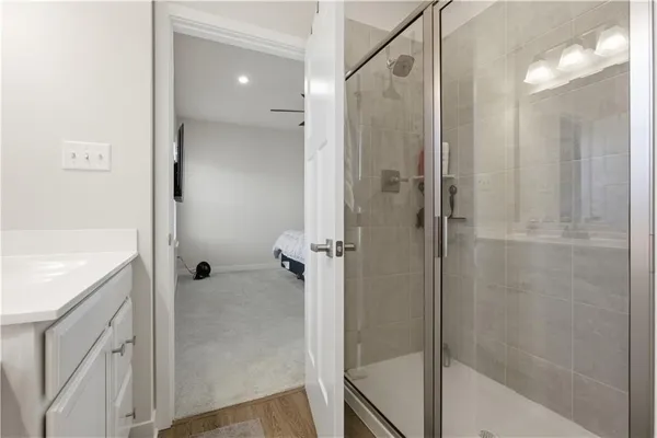 a bathroom with a shower and a sink