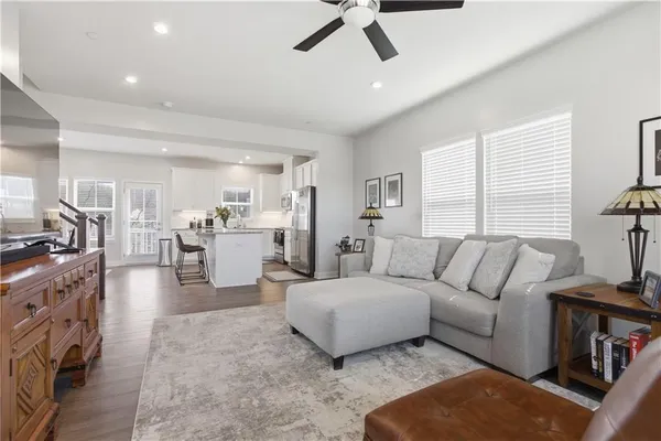 a living room with furniture and a large window