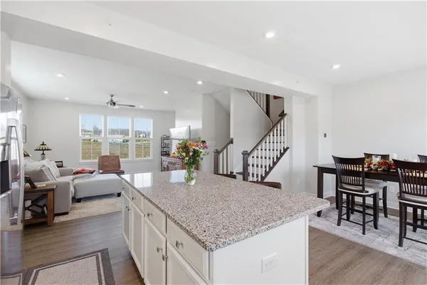 an empty room with wooden floor and closet
