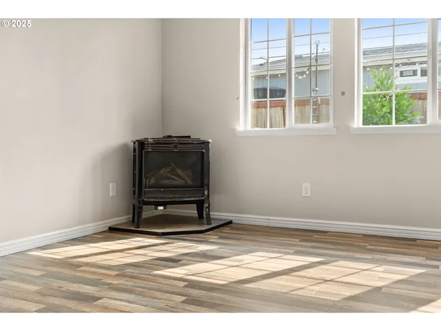 a view of a room with wooden floor