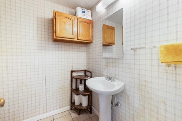 167 Edgewater Drive Temple, GA 30179 - Photo 28 of 37 a bathroom with a sink a mirror and a toilet