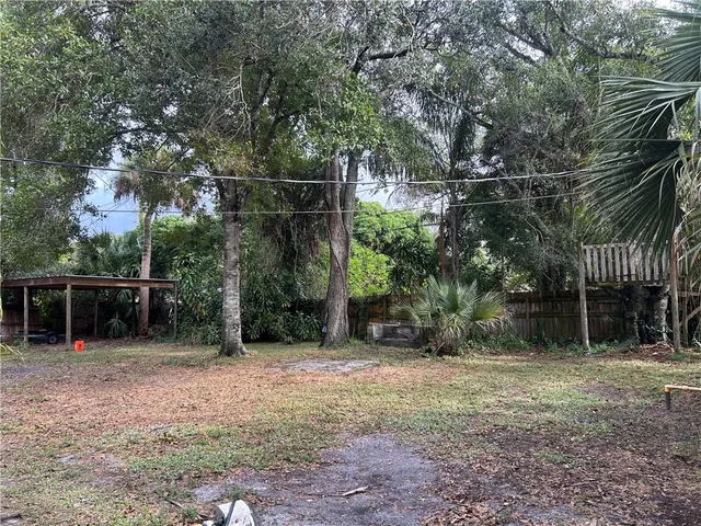 a backyard of a house with lots of green space