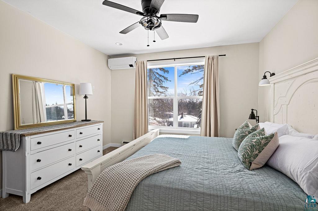 2236 Hoover Street Duluth, MN 55811 - Photo 14 of 52 Bedroom featuring dark carpet, ceiling fan, and a mini split for heating / cooling