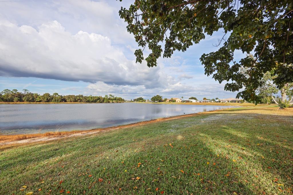 25192 Derringer Road Punta Gorda, FL 33983 - Photo 12 of 39 a view of a lake with a big yard