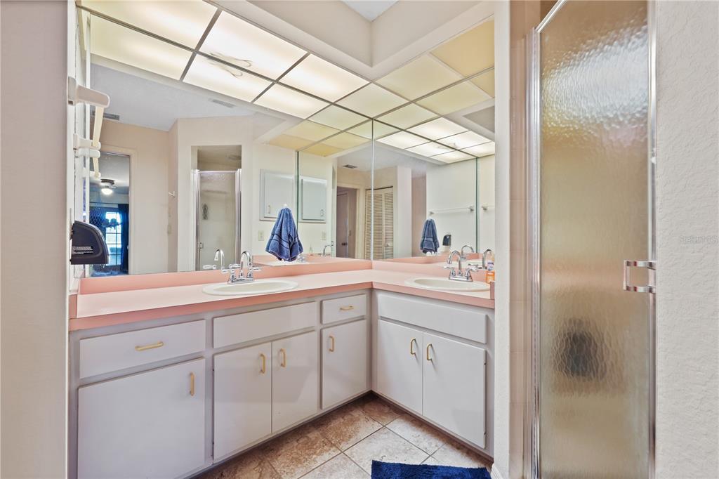 25192 Derringer Road Punta Gorda, FL 33983 - Photo 25 of 39 a bathroom with a double vanity sink and mirror