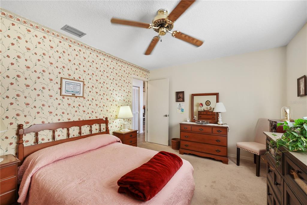 25192 Derringer Road Punta Gorda, FL 33983 - Photo 28 of 39 a bedroom with furniture and window