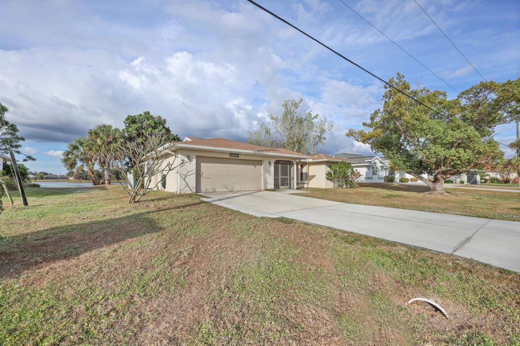 25192 Derringer Road Punta Gorda, FL 33983 - Photo 37 of 39 a front view of house with yard