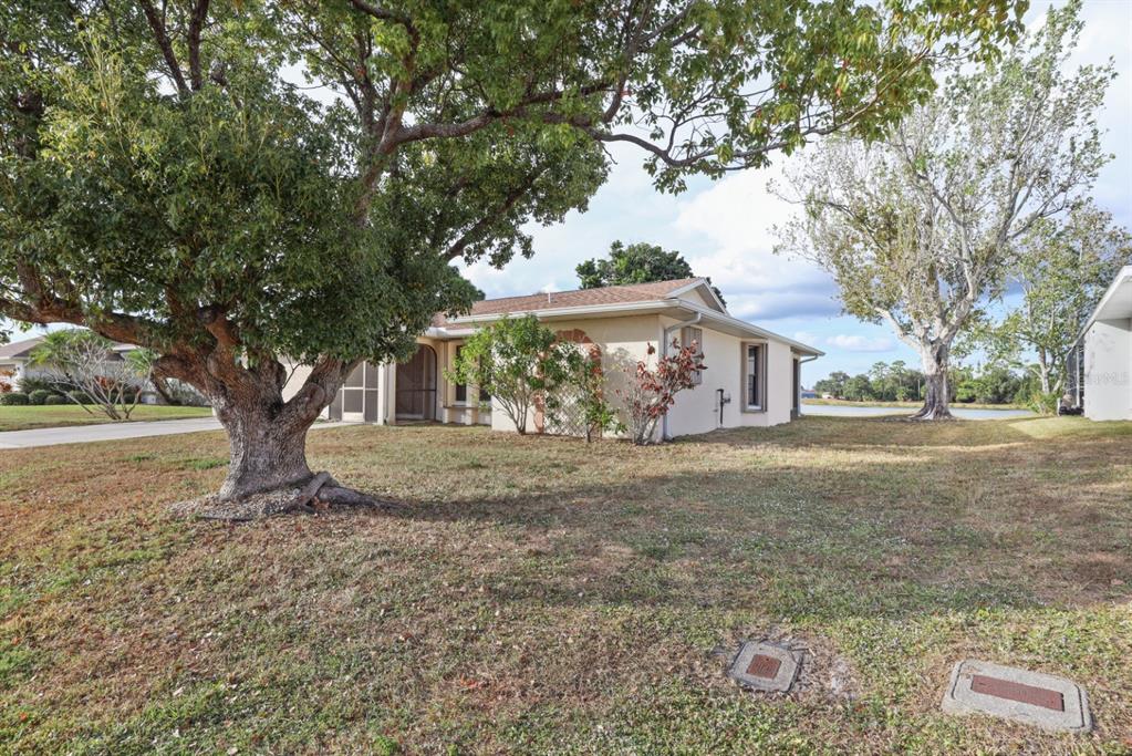 25192 Derringer Road Punta Gorda, FL 33983 - Photo 7 of 39 a view of a house with a tree s