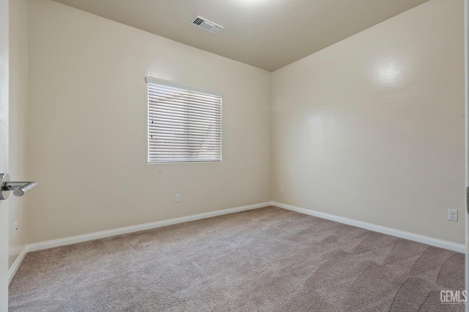 Undisclosed Address Bakersfield, CA 93311 - Photo 12 of 27 an empty room with a window
