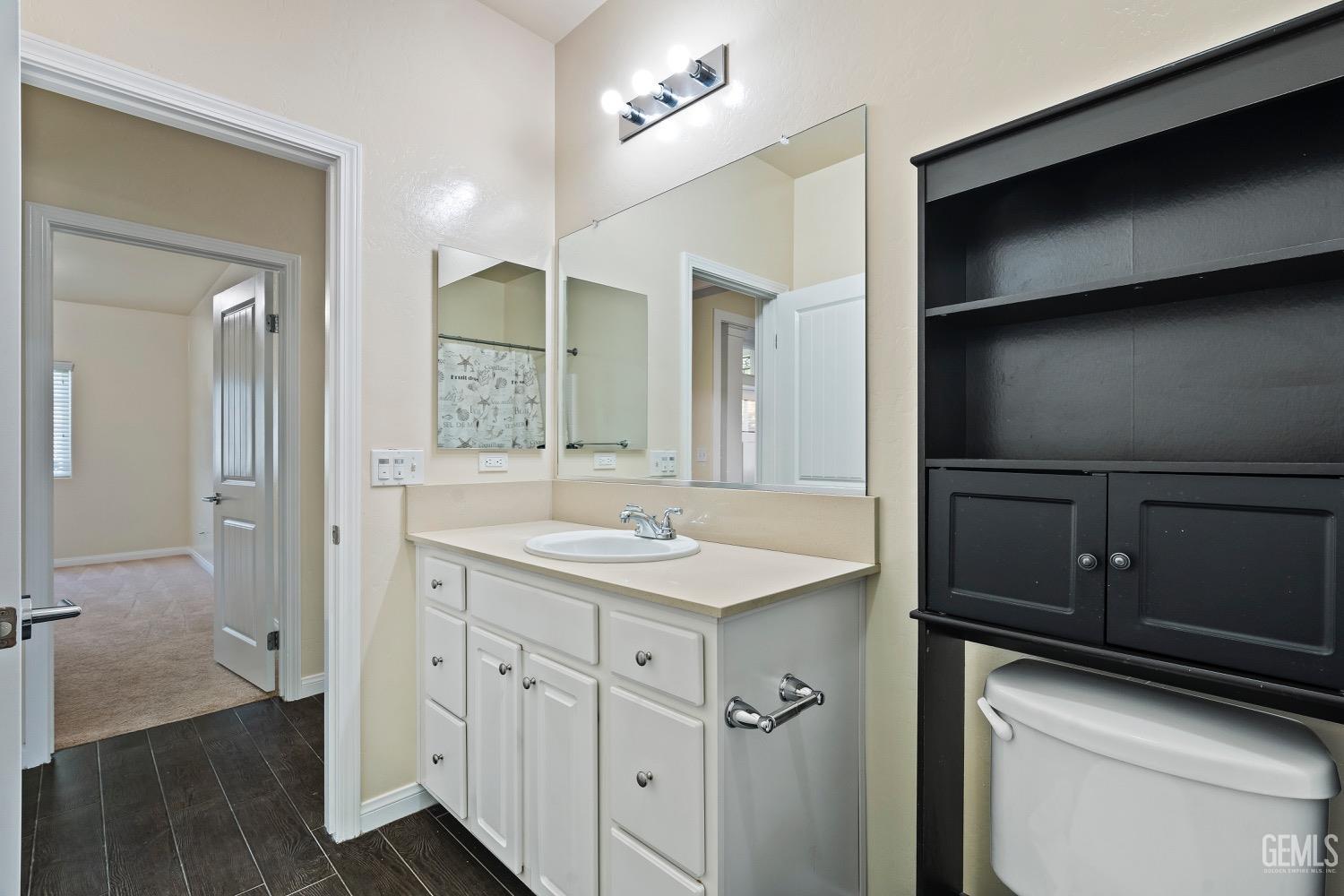 Undisclosed Address Bakersfield, CA 93311 - Photo 14 of 27 a bathroom with a sink and a mirror