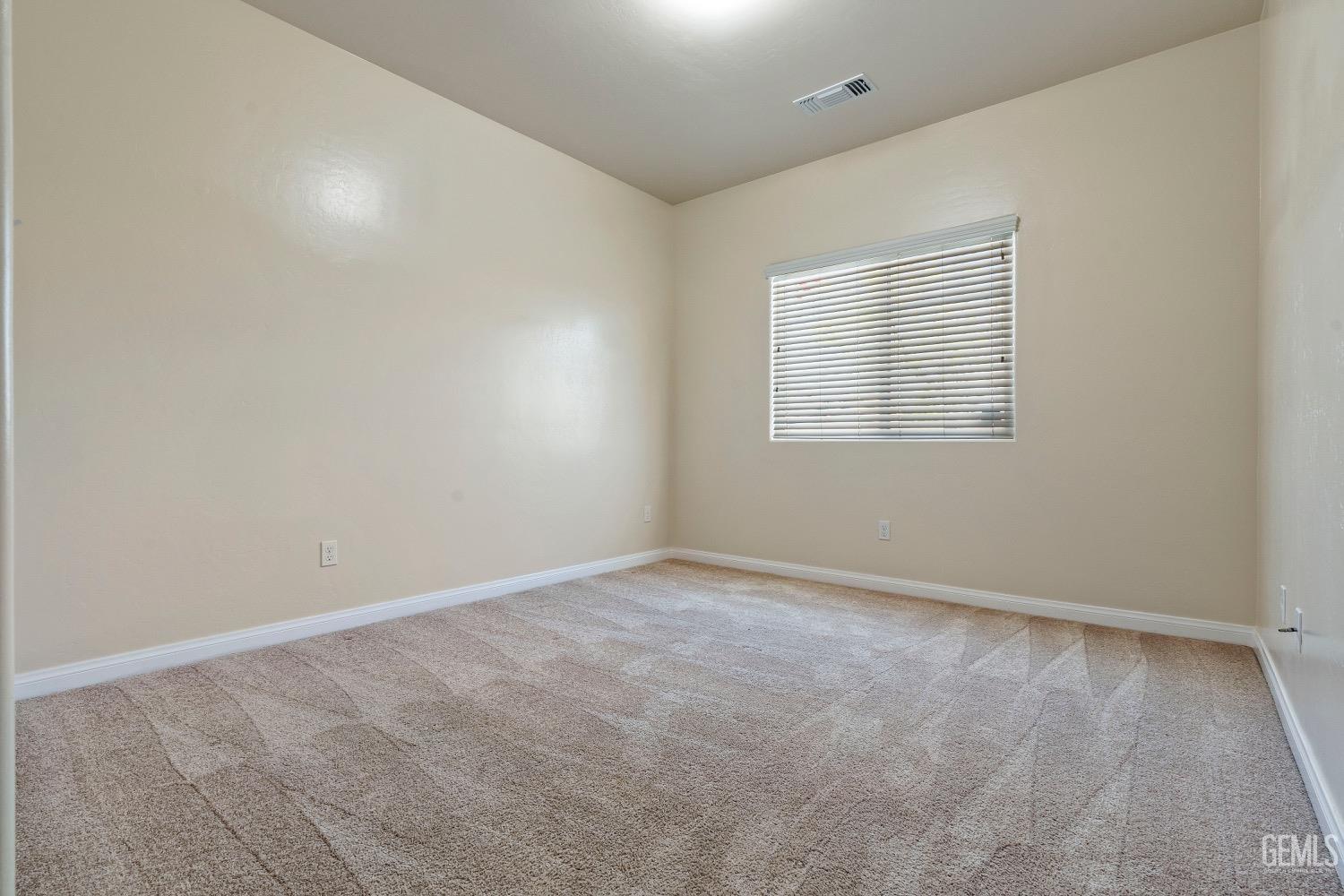 Undisclosed Address Bakersfield, CA 93311 - Photo 15 of 27 an empty room with a window
