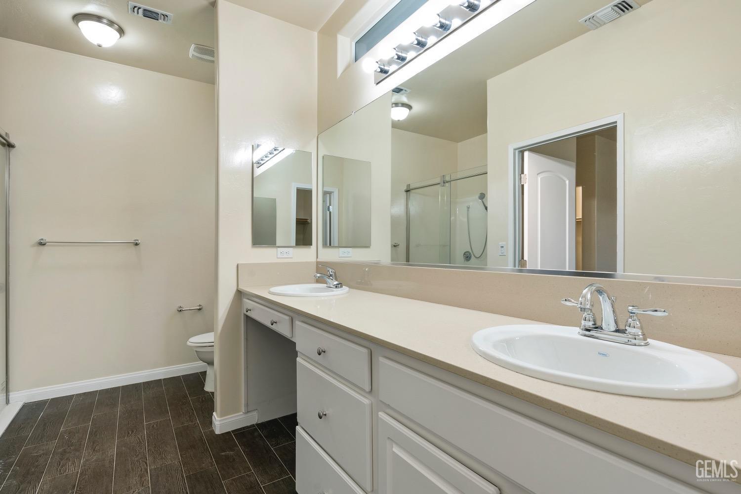 Undisclosed Address Bakersfield, CA 93311 - Photo 21 of 27 a bathroom with a sink and a mirror