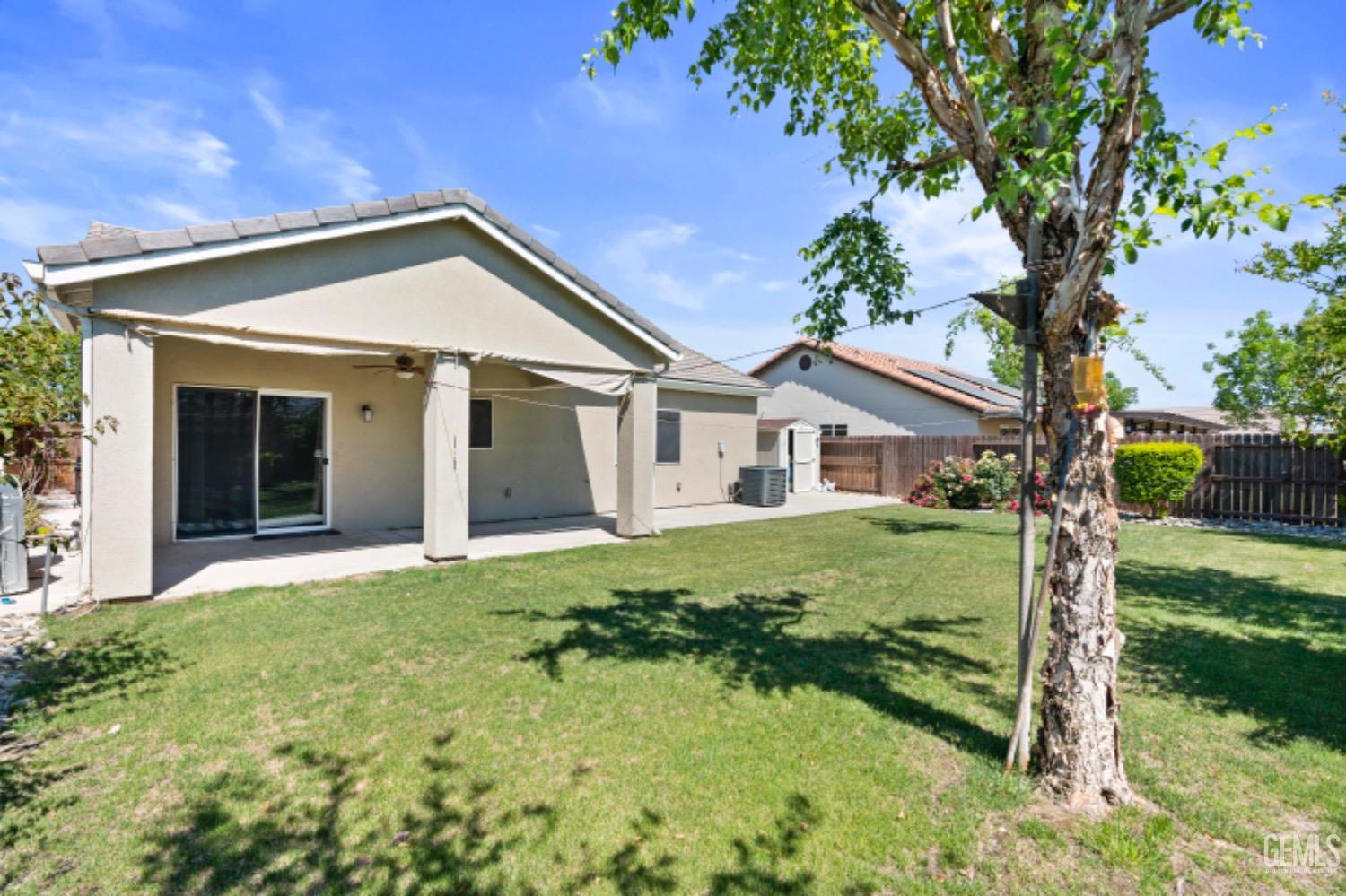 Undisclosed Address Bakersfield, CA 93311 - Photo 23 of 27 a view of a house with a yard