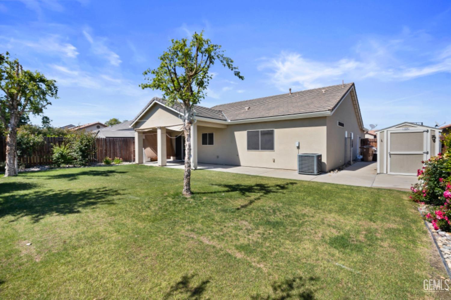 Undisclosed Address Bakersfield, CA 93311 - Photo 24 of 27 a front view of a house with a yard