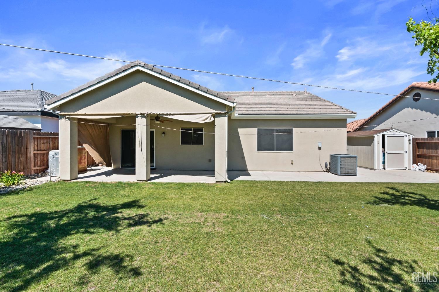 Undisclosed Address Bakersfield, CA 93311 - Photo 25 of 27 a front view of a house with a yard