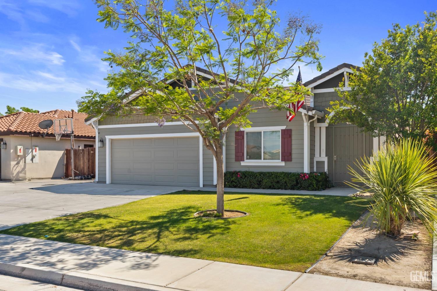 Undisclosed Address Bakersfield, CA 93311 - Photo 3 of 27 a front view of a house with garden