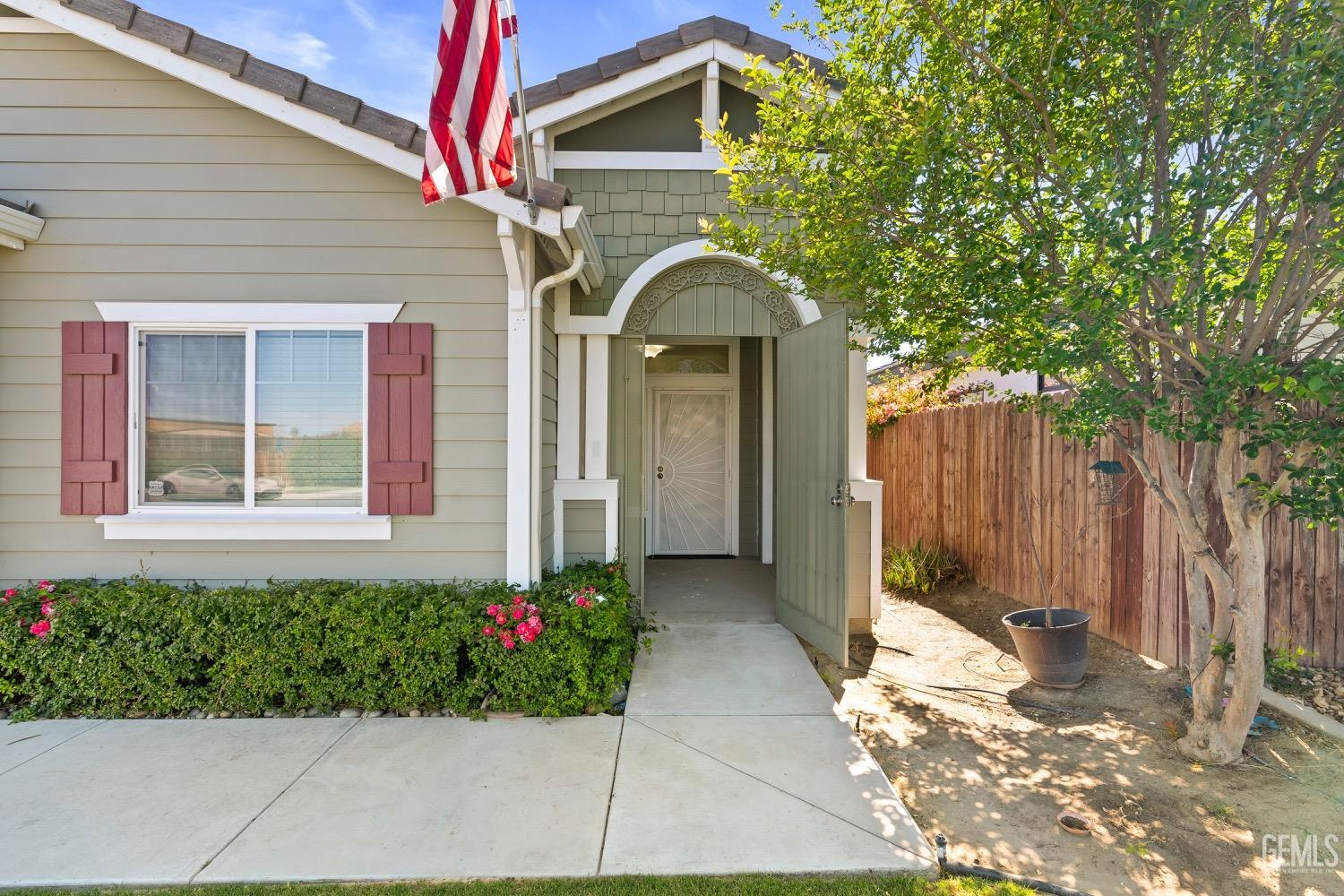 Undisclosed Address Bakersfield, CA 93311 - Photo 4 of 27 a front view of a house with garden