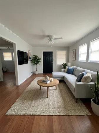 a living room with furniture and a flat screen tv