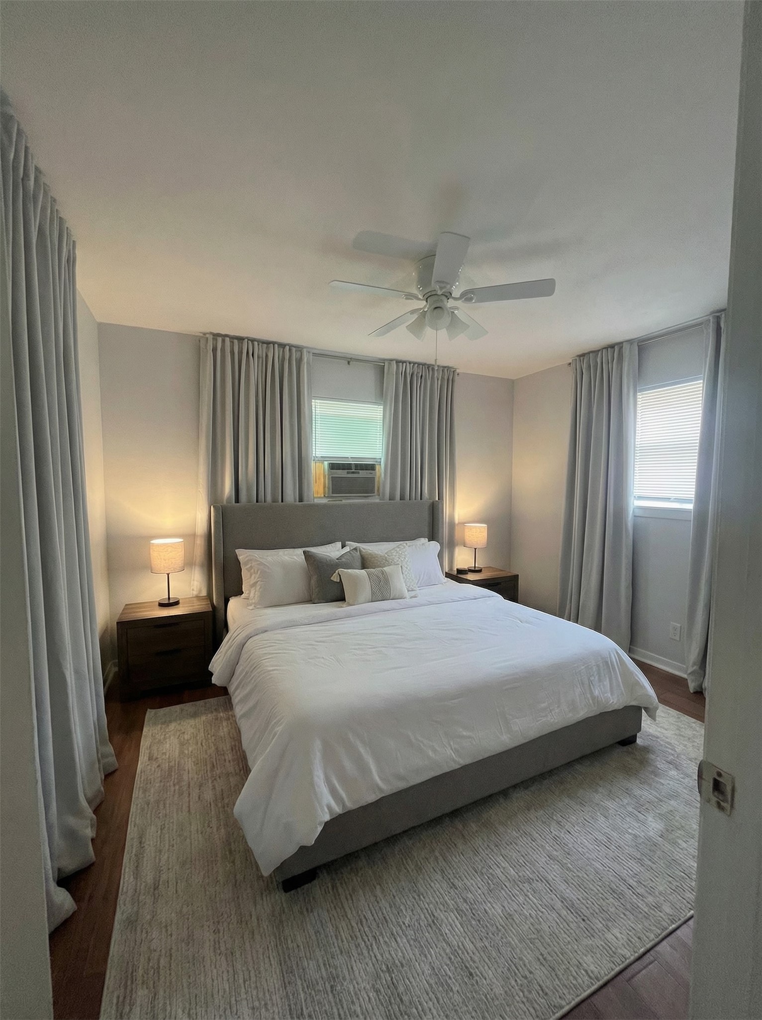 4911 Delano Street, Unit 1 Houston, TX 77004 - Photo 6 of 14 a bedroom with a bed and a mirror