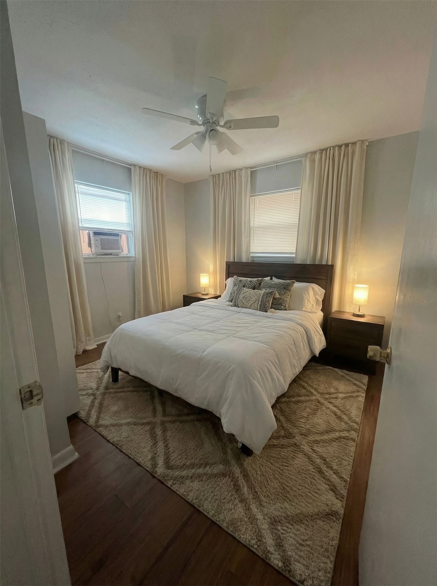4911 Delano Street, Unit 1 Houston, TX 77004 - Photo 10 of 14 a bedroom with a bed and window